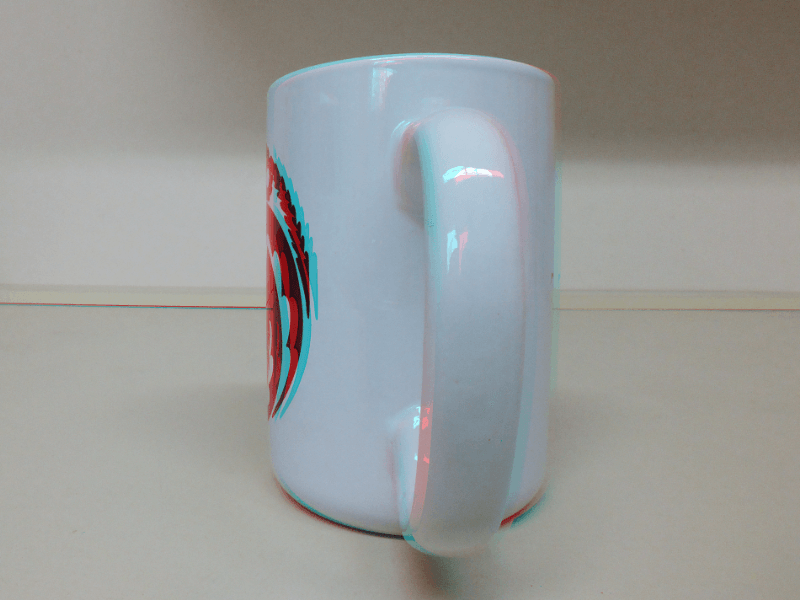 Impressive 3D effect. The mug's handle seems to extends beyond the screen, inviting you to reach out and grasp it—an illusion of depth that blurs the boundary between the virtual and the tangible.