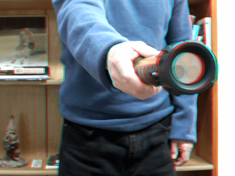 3D image of me holding a flashlight. The flashlight appears to come out of the screen.