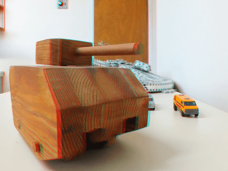 3D image of a wooden tank with the illusion of depth. The tank appears to extend beyond your screen.