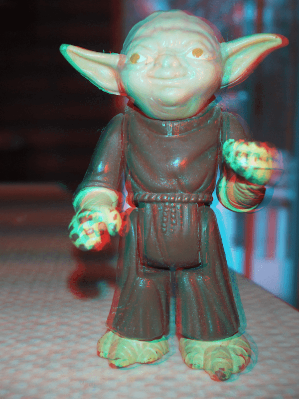 Hologram like image of a toy Yoda that appears to be in front of your screen.